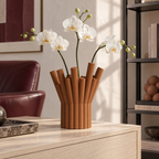 Rivolo Sculptural Vase – cognac brown lifestyle reading room rivolo sculptural vase